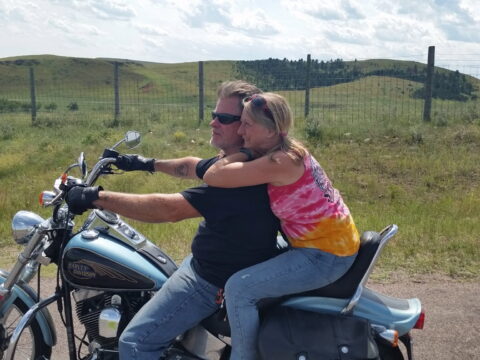 Photo of Mark and his wife Linda on his Harley.